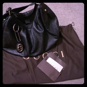 100% authentic black leather Gucci handbag